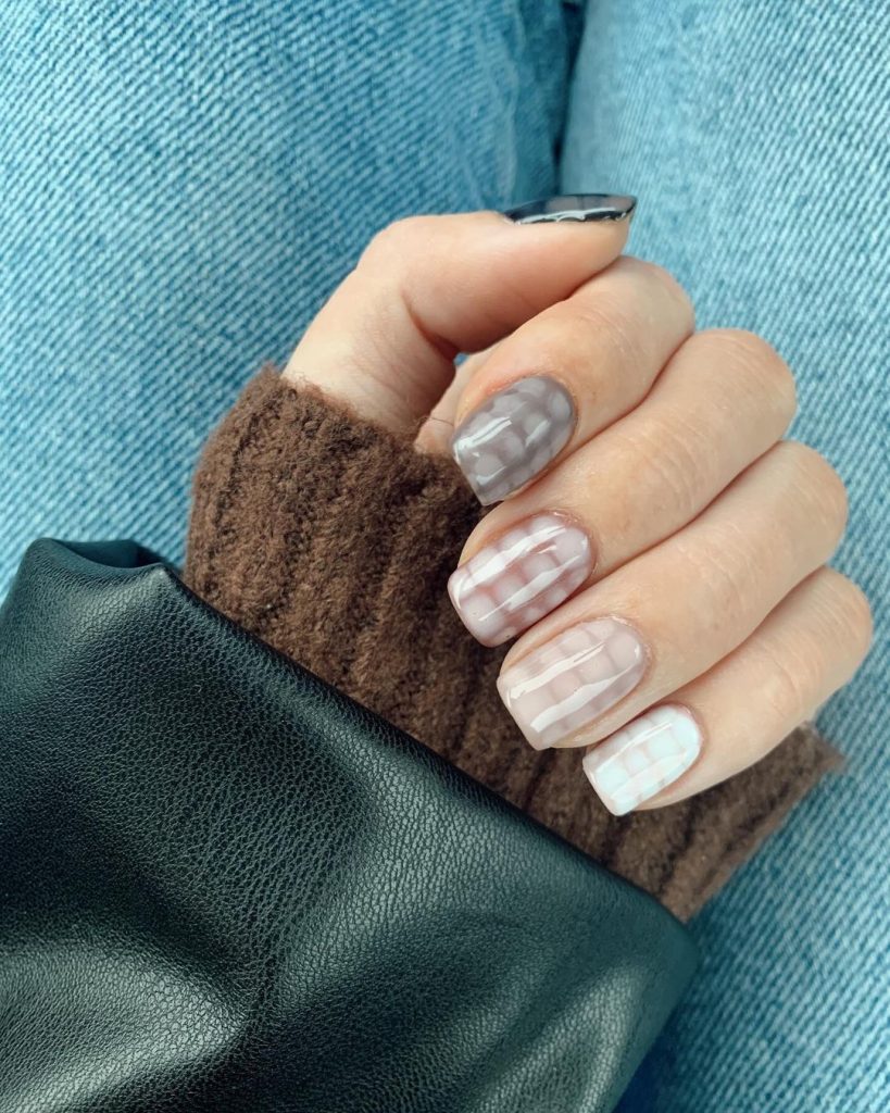 neutral nails with snake skin design