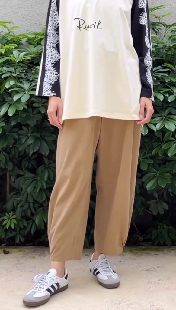 camel-colored pants with sneakers