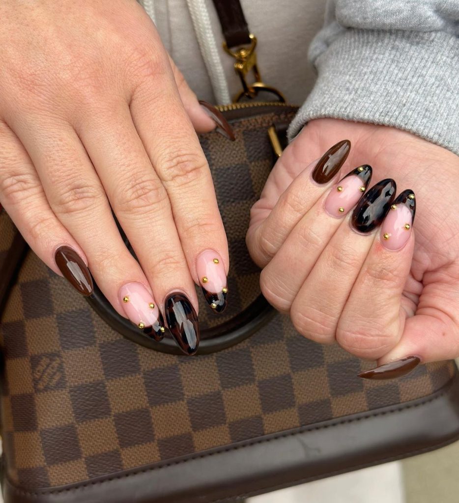 brown and gold nails with tortoise shell designs